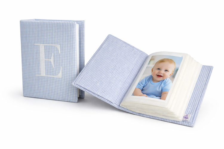 View of small photo album open to show 4x6 print vertically in album
